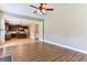 Open living area with kitchen access and hardwood floors at 4001 Village Crossing Cir, Ellenwood, GA 30294