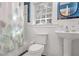 Clean bathroom with white subway tiles and pedestal sink at 841 United Se Ave, Atlanta, GA 30312