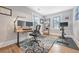 Home office with standing desk, two monitors, and exercise bike at 841 United Se Ave, Atlanta, GA 30312