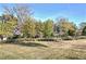 Open green space with mature trees and houses in the background at 841 United Se Ave, Atlanta, GA 30312