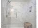 Large shower with marble tile and built-in bench at 841 United Se Ave, Atlanta, GA 30312