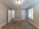 Well-lit bedroom featuring carpet and ample space at 3110 Mcafee Rd, Decatur, GA 30032