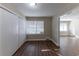 Spacious bedroom with hardwood floors and access to living room at 3110 Mcafee Rd, Decatur, GA 30032