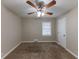 Bedroom with ceiling fan, carpet, and window with blinds at 3110 Mcafee Rd, Decatur, GA 30032