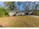Ranch style home with carport and landscaped yard at 3110 Mcafee Rd, Decatur, GA 30032