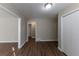 Bright hallway with wood-look flooring and access to other rooms at 3110 Mcafee Rd, Decatur, GA 30032