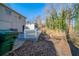 View of backyard with deck and sloped terrain at 491 Elbridge Nw Dr, Atlanta, GA 30318