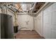 Unfinished basement with laundry hookups and water heater at 491 Elbridge Nw Dr, Atlanta, GA 30318