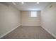 Finished basement with neutral walls and carpet at 491 Elbridge Nw Dr, Atlanta, GA 30318