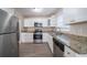 Modern kitchen with granite countertops and stainless steel appliances at 491 Elbridge Nw Dr, Atlanta, GA 30318