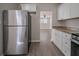 Modern kitchen with granite countertops and stainless steel appliances at 491 Elbridge Nw Dr, Atlanta, GA 30318