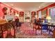 Spacious living room with red walls, ornate rug, and fireplace at 5080 Northland Ne Dr, Atlanta, GA 30342