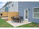 Spacious patio with seating area and fenced backyard at 1180 Chastain Dr # 9, Sugar Hill, GA 30518