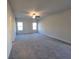 Large bedroom with ceiling fan and carpet flooring at 28 Loth Wages (Lot 28) Rd, Dacula, GA 30019