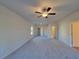 Main bedroom with ceiling fan and carpet flooring at 28 Loth Wages (Lot 28) Rd, Dacula, GA 30019