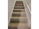 Carpeted staircase leading to the second floor at 28 Loth Wages (Lot 28) Rd, Dacula, GA 30019