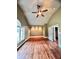 Spacious bedroom with hardwood floors and a ceiling fan at 2842 Cardinal Lake Dr, Duluth, GA 30096