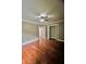 Hardwood floor bedroom with ceiling fan and closet at 2842 Cardinal Lake Dr, Duluth, GA 30096