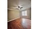 Hardwood floor bedroom with ceiling fan and large windows at 2842 Cardinal Lake Dr, Duluth, GA 30096