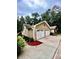 Two-car garage with concrete driveway and landscaping at 2842 Cardinal Lake Dr, Duluth, GA 30096