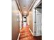 Hallway with hardwood floors and neutral colored walls at 2842 Cardinal Lake Dr, Duluth, GA 30096