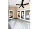 Sunroom with hardwood floors, ceiling fan and French doors at 2842 Cardinal Lake Dr, Duluth, GA 30096