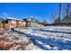 Large backyard with light snow cover and a partially visible house at 4593 Bexley Way, Stone Mountain, GA 30083