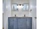 Bathroom with double vanity and hexagon tile backsplash at 4593 Bexley Way, Stone Mountain, GA 30083