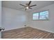 Bright bedroom with wood-look floors and ceiling fan at 4593 Bexley Way, Stone Mountain, GA 30083