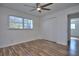 Spacious bedroom with wood-look floors and ceiling fan at 4593 Bexley Way, Stone Mountain, GA 30083