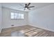 Bright bedroom with wood-look floors and ceiling fan at 4593 Bexley Way, Stone Mountain, GA 30083