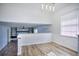 Bright dining area with hardwood floors and a view into the living room at 4593 Bexley Way, Stone Mountain, GA 30083