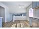 Bright dining area with hardwood floors and a view into the living room at 4593 Bexley Way, Stone Mountain, GA 30083