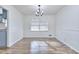 Spacious dining room with hardwood floors and a chandelier at 4593 Bexley Way, Stone Mountain, GA 30083