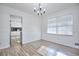 Bright dining room with hardwood floors and view into kitchen at 4593 Bexley Way, Stone Mountain, GA 30083