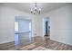 Dining room with hardwood floors, open to living room and kitchen at 4593 Bexley Way, Stone Mountain, GA 30083