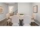 Dining room with oval wooden table, six beige chairs, and botanical artwork at 5571 Hislop Ln # 41, Mableton, GA 30126