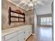 White built-in cabinets with a wooden shelf above at 6 Westchester Sq, Decatur, GA 30030