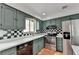 Kitchen with stainless steel appliances and green cabinets at 6 Westchester Sq, Decatur, GA 30030