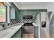 Kitchen with stainless steel appliances and green cabinets at 6 Westchester Sq, Decatur, GA 30030