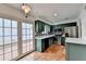 Galley kitchen with green cabinets and terracotta tile floor at 6 Westchester Sq, Decatur, GA 30030