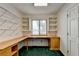 Home office with wood desk, built-in shelving, and green carpet at 6 Westchester Sq, Decatur, GA 30030