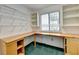 Home office with wood desk, built-in shelving, and green carpet at 6 Westchester Sq, Decatur, GA 30030