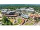 Aerial view of vibrant community with shops, restaurants, and residential buildings at 1182 Chastain Dr # 8, Sugar Hill, GA 30518