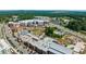 Aerial view of Cornerstone, a vibrant mixed-use development with residential buildings, shops, and a town center at 1182 Chastain Dr # 8, Sugar Hill, GA 30518