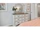White dresser with seven drawers and mirror in bedroom at 1182 Chastain Dr # 8, Sugar Hill, GA 30518