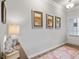 Bright entryway with hardwood floors and modern wall art at 1182 Chastain Dr # 8, Sugar Hill, GA 30518