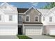Two-story townhome with neutral siding and a brown roof at 1182 Chastain Dr # 8, Sugar Hill, GA 30518