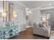 Living room with hardwood floors and a light gray sofa at 1182 Chastain Dr # 8, Sugar Hill, GA 30518