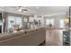Open living room features hardwood floors, a cozy seating area, and an adjacent kitchen at 1182 Chastain Dr # 8, Sugar Hill, GA 30518